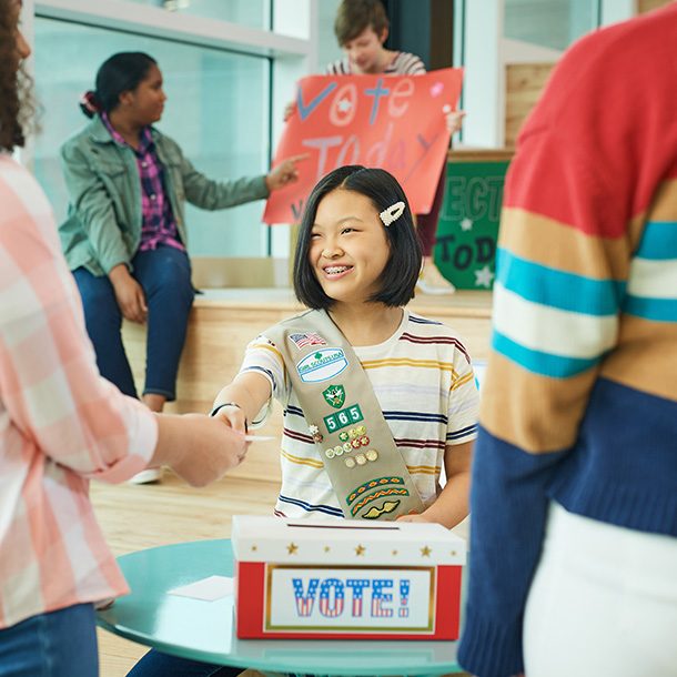 girl shaking hands with adult