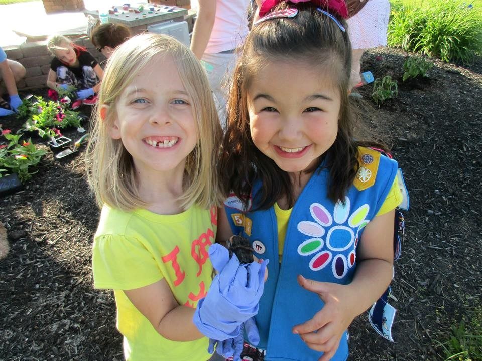 young girls on ground laughing