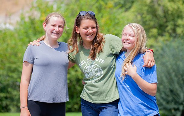 three older girls laughing