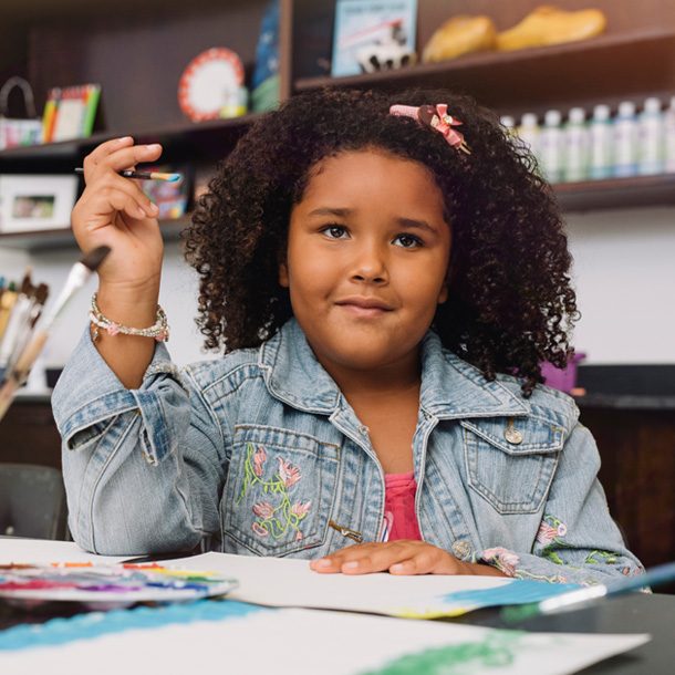 girl on art table