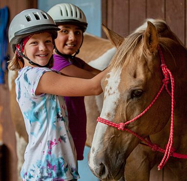 two girls with horse