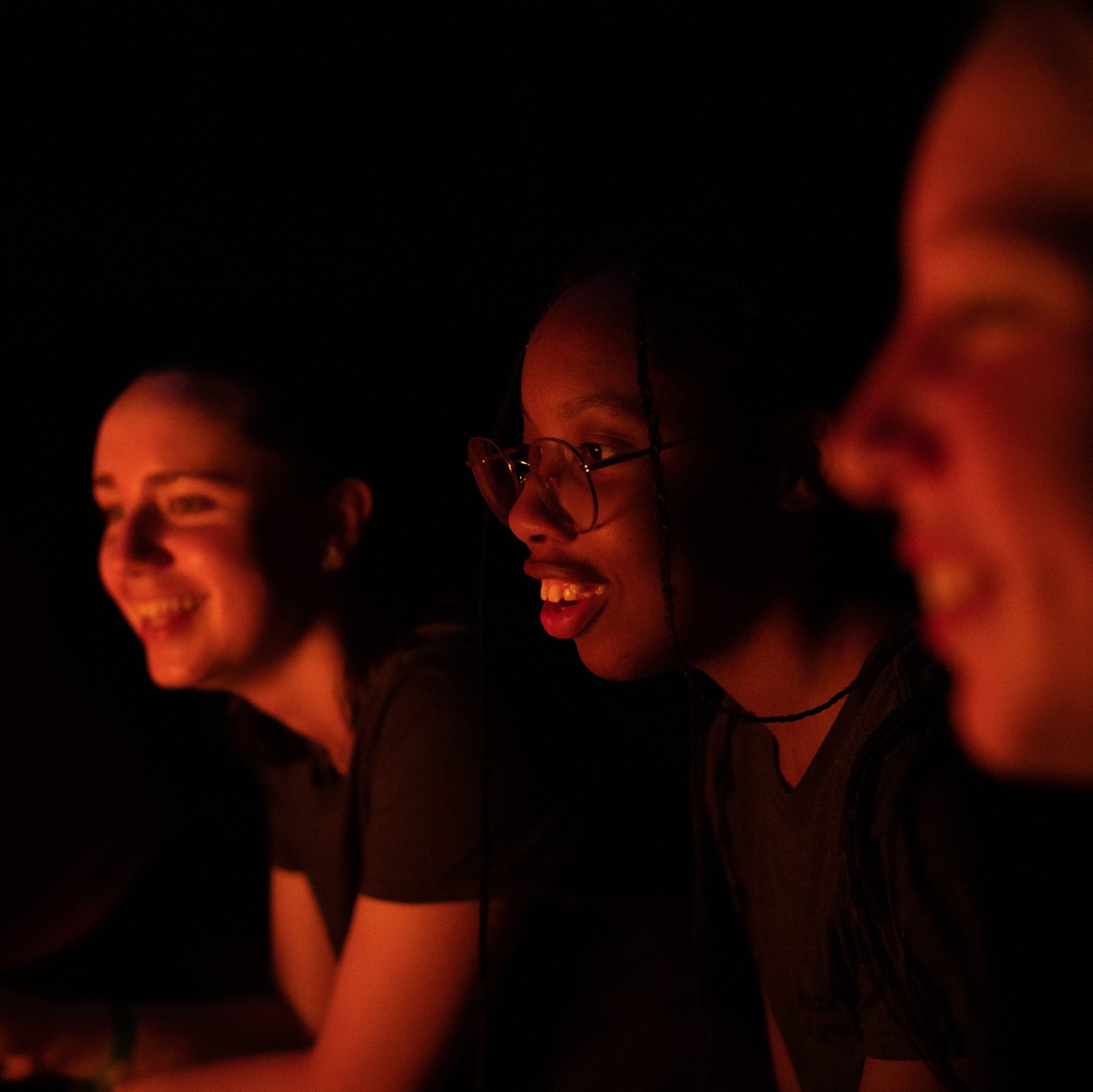 three girls roasting marshmallows 