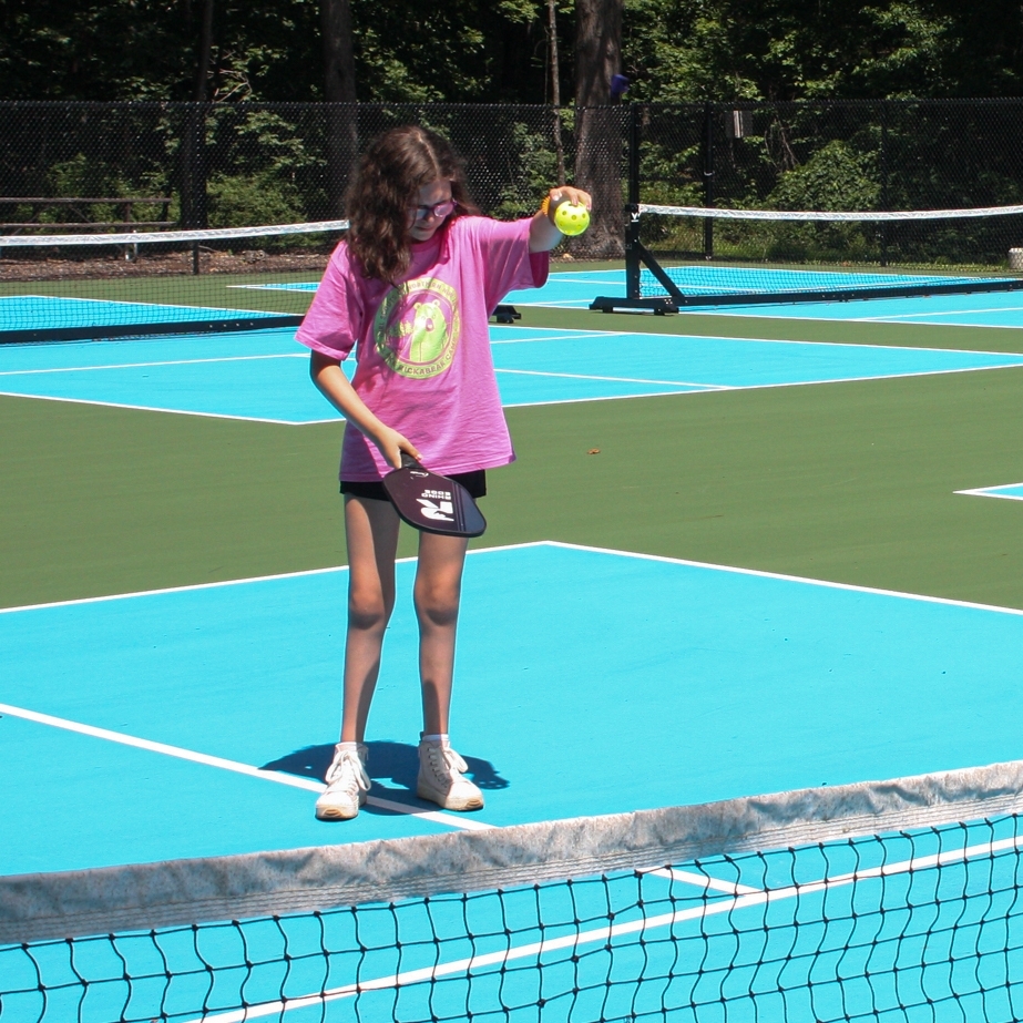 three girls roasting marshmallows 