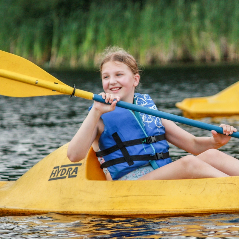 three girls roasting marshmallows 