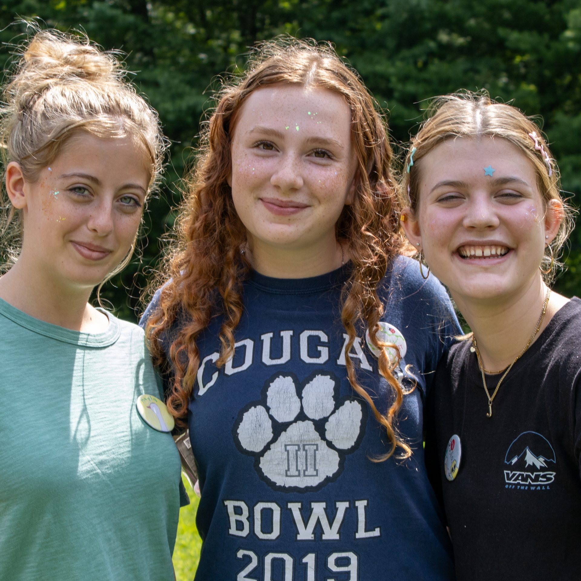 three girls roasting marshmallows 