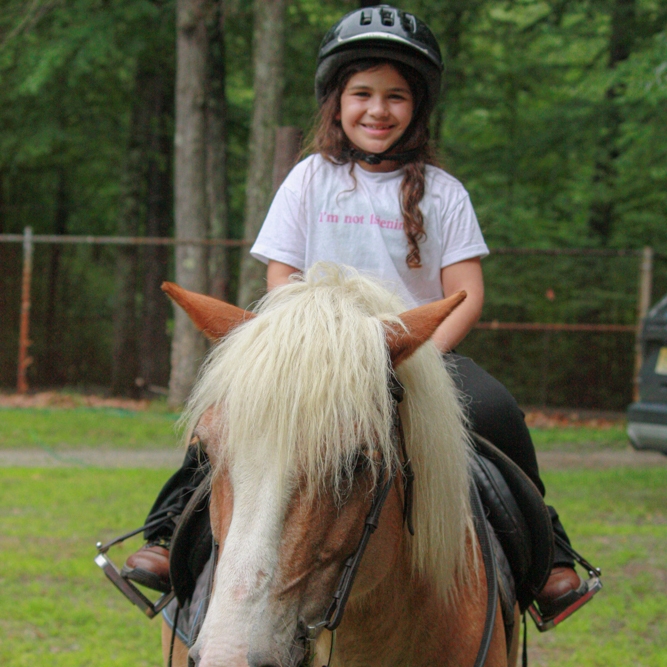 three girls roasting marshmallows 